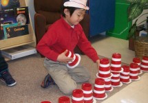 One of our  pre k student enjoyed a stacking activity in our construction area.  His math skills were also enriched as he counted the cups as he lined the up.
